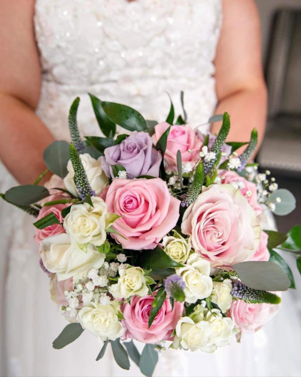 Bride with wedding flowers by The Flower Shop Cumnock