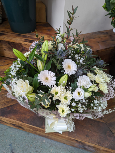Serene Blooms Bouquet - A beautifully handcrafted bouquet in soft white tones, featuring elegant seasonal blooms for a timeless gift that's perfect for celebrating, comforting or simply letting someone know you're thinking of them.