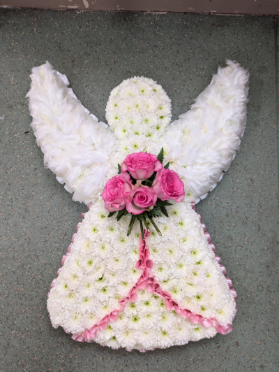 Peaceful Angel - A graceful angel tribute in white with delicate pink accents, beautifully handcrafted to offer a heartfelt and comforting farewell to a loved one.